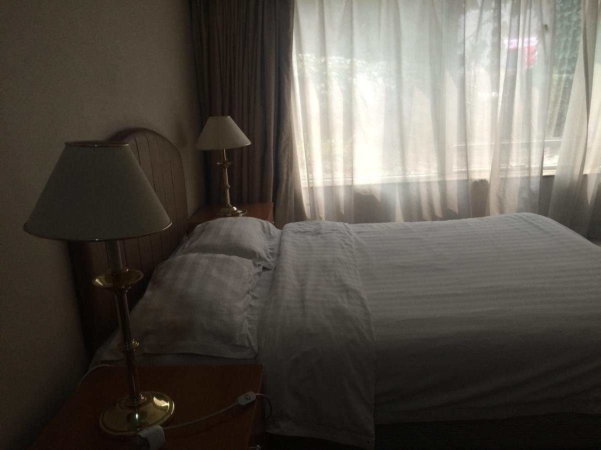Beijing New World Centre Aparthotel Extérieur photo